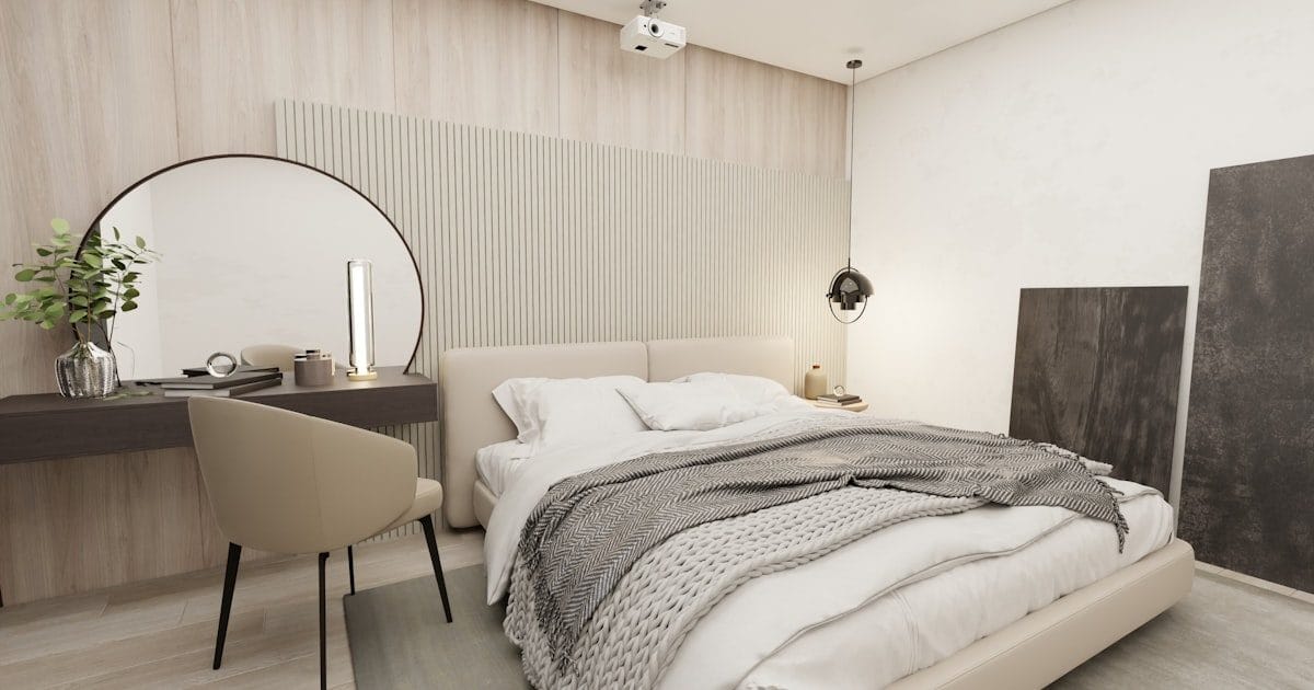 Möbliertes Schlafzimmer mit Bett und Schreibtisch in einer Monteurwohnung